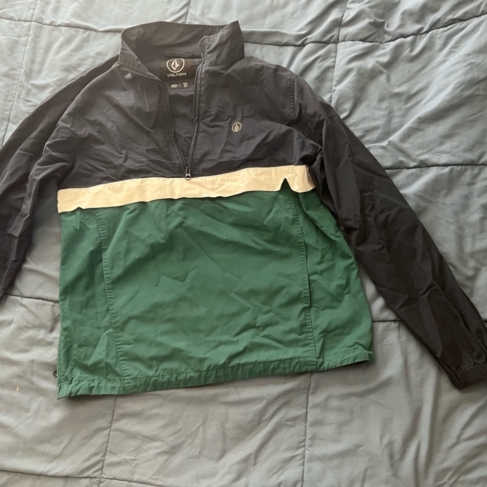 Blue and white volcom pullover windbreaker